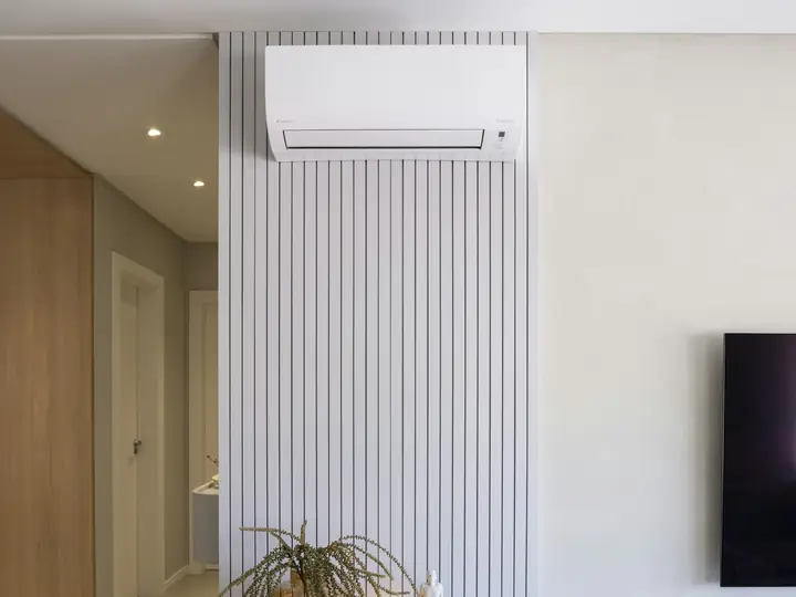 Wall-mounted ductless air conditioner in a modern room